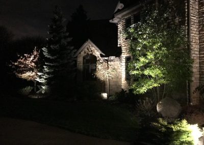 Ash project home exterior lit up in the evening