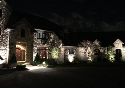 Ash project home exterior lit up in the evening