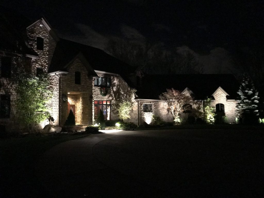 Ash project home exterior lit up in the evening