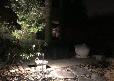 Ash project home exterior lit up in the evening